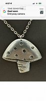 Front view of mushroom pendant on chain