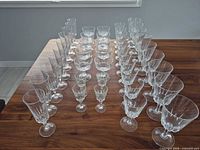 All 43 pieces arranged on table, showing variety of glass types