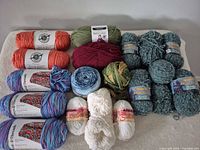 All 16 skeins laid out on surface