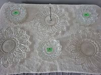 Overview of six representative pieces including handled server, large plates, small bowls, small plates