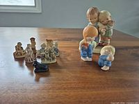 All ten figurines displayed on tabletop