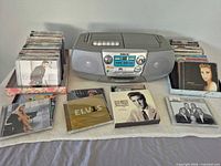 Front view of Sony CFD-V7 boombox with two stacks of CDs