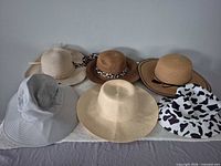 Group shot of six hats arranged side by side