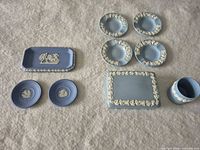 All nine Wedgwood Jasperware pieces laid out