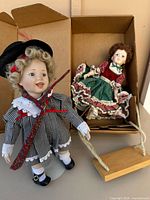 Both dolls, swing, stands inside box
