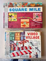 Both game boxes, Square Mile on top of Video Village