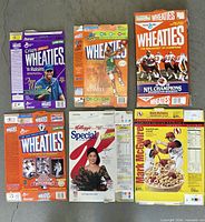 Six flattened cereal boxes laid out showing fronts and backs