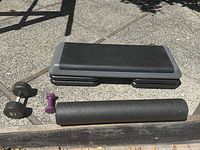 step platform with risers, foam roller, dumbbells