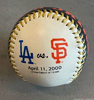 Pacific Bell Park Opening Day baseball showing team logos and date