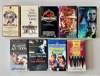 Nine VHS tapes laid out showing front covers