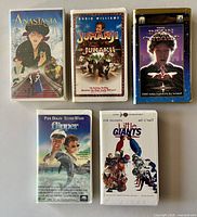 Front covers of five VHS tapes: Anastasia, Jumanji, The Indian in the Cupboard, Flipper, Little Giants
