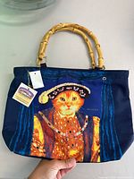 Front view of Signare Cat Majesty bag with tag visible