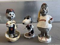 Front view of all three bobbleheads
