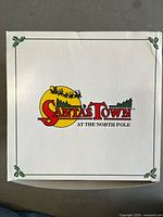 Exterior of original white box showing Santa’s Town at the North Pole logo
