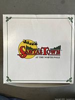 Top of Santa's Town box showing logo