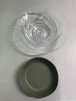 Olive green Hearth & Hand bowl and clear glass swirl bowl overhead view