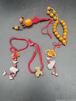 Group shot of five good luck charms showing overall condition and quantity