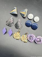 All seven earring pairs laid out