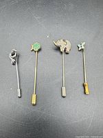 All four animal motif stick pins with clutches