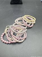 All bracelets stacked showing color variety