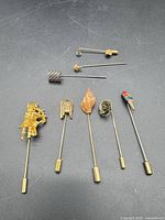 All seven pins arranged on black surface