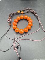 Bracelet and necklace full view on surface