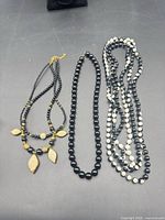 All three necklaces laid out to show overall styles and bead designs