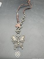 Full view of necklace showing pendant, beads, leather cord