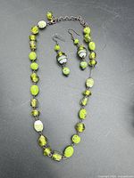 Necklace and earrings laid out