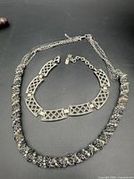 Top view of both necklaces showing overall design and clasps