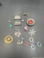 Group shot of all pendants and charms on black background