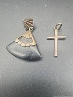 Cross pendant and single earring overview
