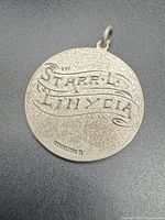 Reverse with scroll inscription and STERLING D mark