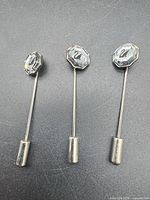 Three Swarovski crystal stick pins side by side