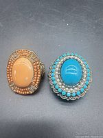 Both statement stretch rings side by side