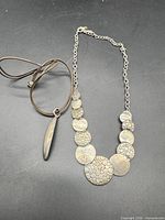 Both necklaces laid flat for overview