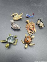 Overview of all seven animal brooches