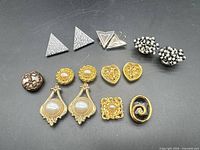 Group shot of all fifteen button covers arranged on black background