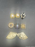 All eight button covers laid out on black background