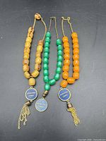 Overview of three komboloi strands