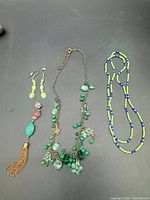 All jewelry pieces laid out on black surface