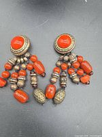 Front view showing both earrings and bead details