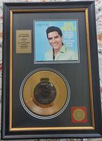 Entire framed plaque showing gold record, Elvis photo, information plate