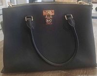Front view showing MK logo, handles and gold hardware