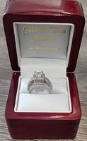 Ring in branded presentation box, frontal view