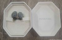 ring in open Swarovski box