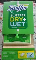 Front of opened Swiffer Sweeper Dry + Wet kit box showing contents list