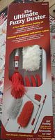 Front of boxed Ultimate Fuzzy Duster 4-piece kit showing contents