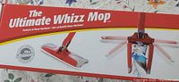 Front of box showing Ultimate Whizz Mop branding and product image