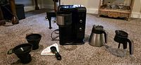 Front view of Ninja coffee maker and all accessories laid out